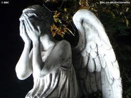 a weeping ange!!!!!!!!! (their so scary) not angels like Gods angels no weeping doctor who angels