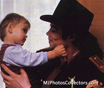  AWWW!! That's so cute! I love to see pics of MJ with kids, it's just so precious, it melts my hart-, hart ;)