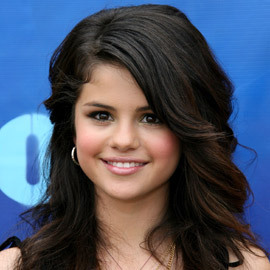 selena gomez of corse she rocks and i would realy not choose miley cuz she isnt the best example