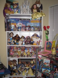  I have the movie on VHS, DVD, and Bluray. Also a whole shelf full of Beauty and the Beast toys, pins, books, dolls, and buttons. Also a movie poster on the wall.