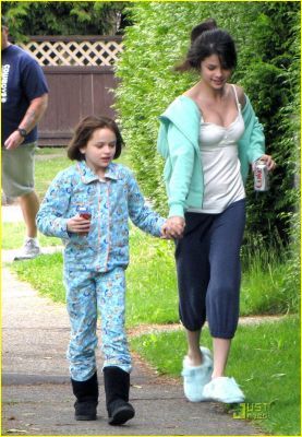 this is a pic of selena with her little co star from ramona and beezus just walking with their pj's and a coke! :)