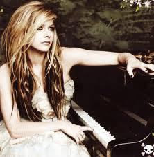 I think she looks really pretty when she plays the piano, and this is one of my favorite pics of her playing :)