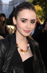  Can te picture Lilly Collins as Katniss? ( She's 21.)