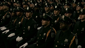  Commissioner Frank Regan's son, Jamie Regan and the newly graduated recruits await in their seats.