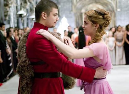 Here you are!

Find a picture of Hermione in her red dress from DH.