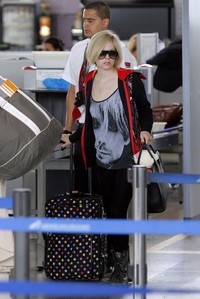  here. avril wearing a red cup.