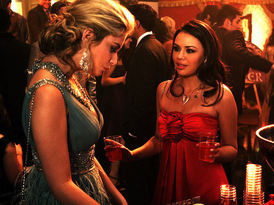 V - Vanderwaal, mona (played by janel parrish) with red dress (right)