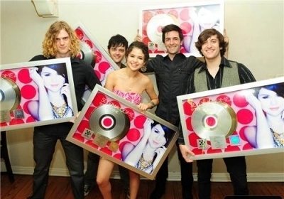 this is a picture of selena and her band on selena's birthday:)