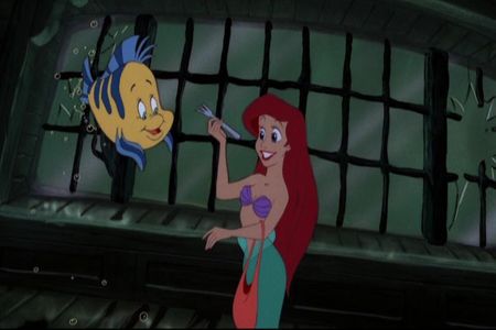  Ariel with Flounder! Next, find a pixture of Jane in her yellow dress.