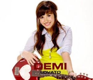 demi with a guitar 3.