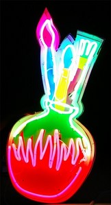 Find a photograph of a brightly colored object(s). 
Example: A Neon Sign