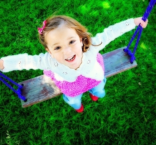 Nessie playing on a swing in the cullens garden