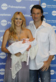 Carolina Cerezuela and Carlos Moya presented to Carla, her first child - tennis photo