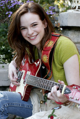 Nessie playing her guitar