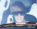 Justin takes a call  - justin-bieber photo