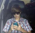 Justin takes a call  - justin-bieber photo