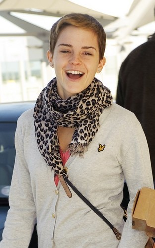  New pics of Emma arriving at Heathrow Airport.