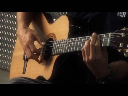 His hands, bracelets and guitar