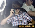 Justin on his phone - justin-bieber photo