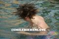 exclusive bieber: hair flip in the water  - justin-bieber photo