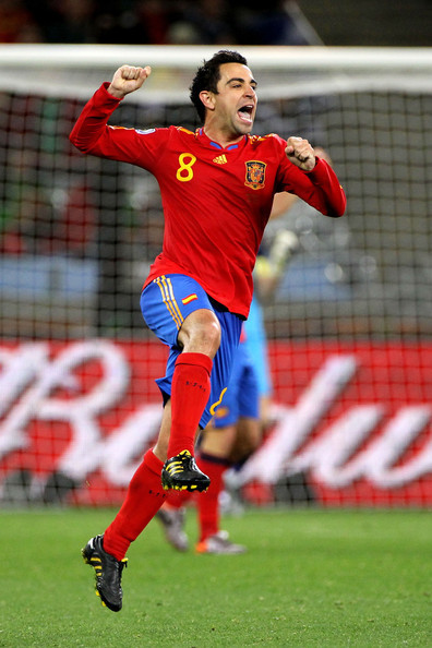http://images4.fanpop.com/image/photos/16500000/Xavi-playing-for-Spain-xavi-hernandez-16584461-396-594.jpg