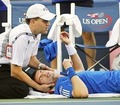 A trainer works on Andy Murray during his match with Stanislas Wawrinka at the US Open - tennis photo