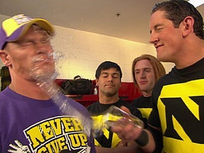 Wade throwing water in Cena's face