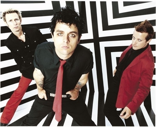 Green Day.....Tre Cool(on the far right) looks creepy XD