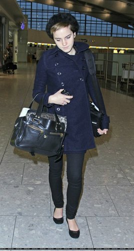  Emma Watson at Heathrow Airport On Friday (December 31st)