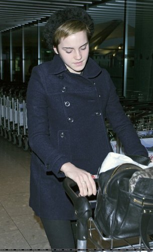 Emma Watson at Heathrow Airport On Friday (December 31st)