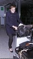 Emma Watson at Heathrow Airport On Friday (December 31st) - emma-watson photo
