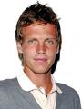 Tomas Berdych has blond hair and blue eyes and  is the opposite dark  Nadal and Federer - tennis photo