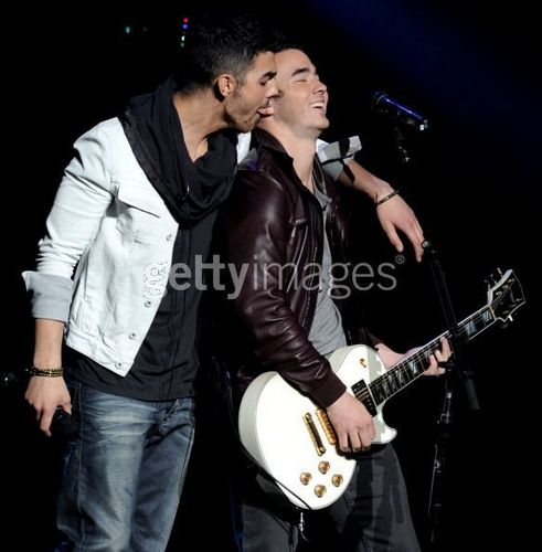  Joe Jonas biting Kevin Jonas's...uh...ear???