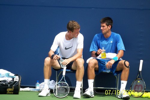 Tomas Berdych speaks with Novak Djokovic