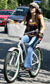 Miley_riding bike - miley-cyrus photo