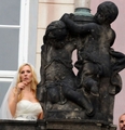 Nicole between statues - tennis photo