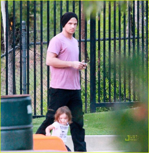 Cam with his daughter on playground in LA