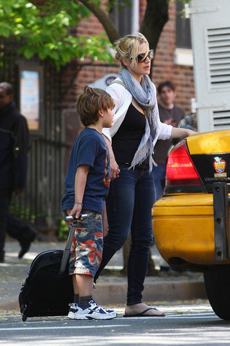 Kate Winslet picks up her son