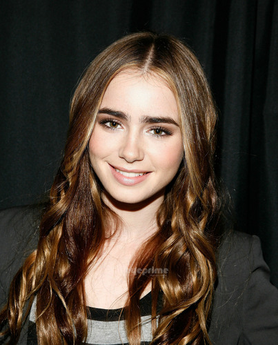 Lily Collins visits the Apple Store Soho.