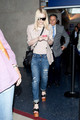 Dakota Fanning's hair flies in the wind as she arrives at LAX (Los Angeles International Airport).  - dakota-fanning photo