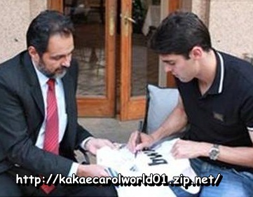  Kaka autographing the jersey of Agnelo Queiroz