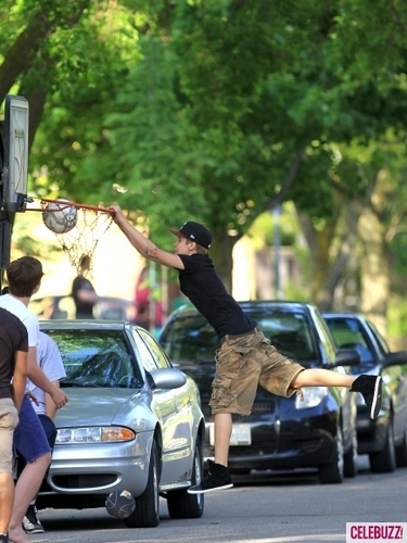 justin bieber plays ball back at home in canada!!