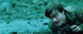 Harry crawling on ground during Battle of Hogwarts - harry-potter photo
