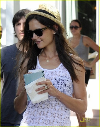  Katie Holmes leaves a restaurant with a cup of coffee in hand on Wednesday