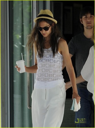 Katie Holmes leaves a restaurant with a cup of coffee in hand on Wednesday 