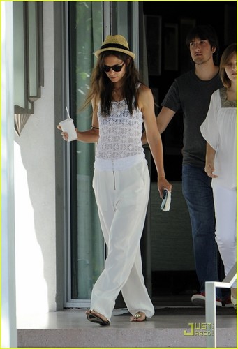 Katie Holmes leaves a restaurant with a cup of coffee in hand on Wednesday 