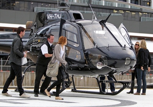 Miley - Returns to Melbourne by helicopter from Phillip Island - June 24, 2011