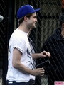 Robert Pattinson on the set of Cosmopolis (with a gun) - robert-pattinson photo
