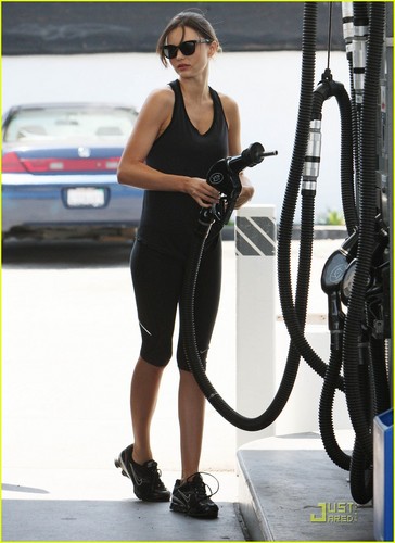  Miranda Kerr stops at a gas station to fill her car up with a full tank of gas on Sunday (July 3)