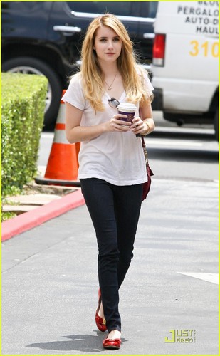Emma Roberts picks up a cup of coffee from Coffee Bean & Tea Leaf in Los Angeles